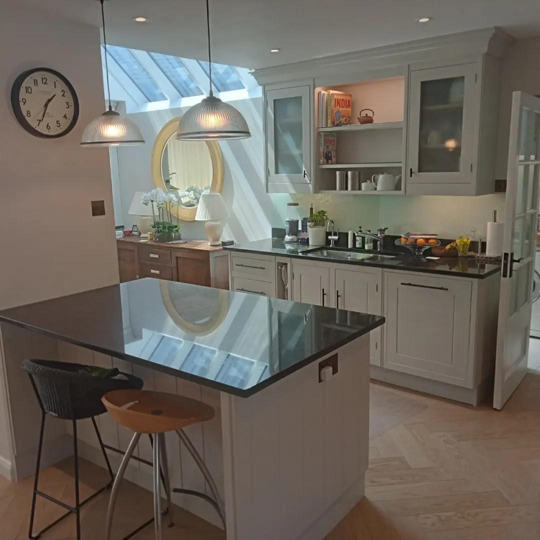 Kitchen with glass doors and a dark island