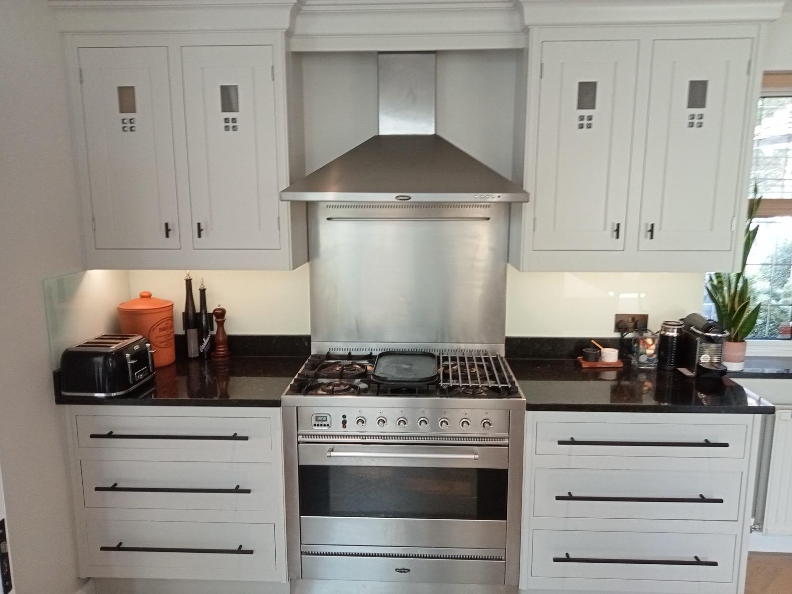 Oven housing of kitchen light grey in colour