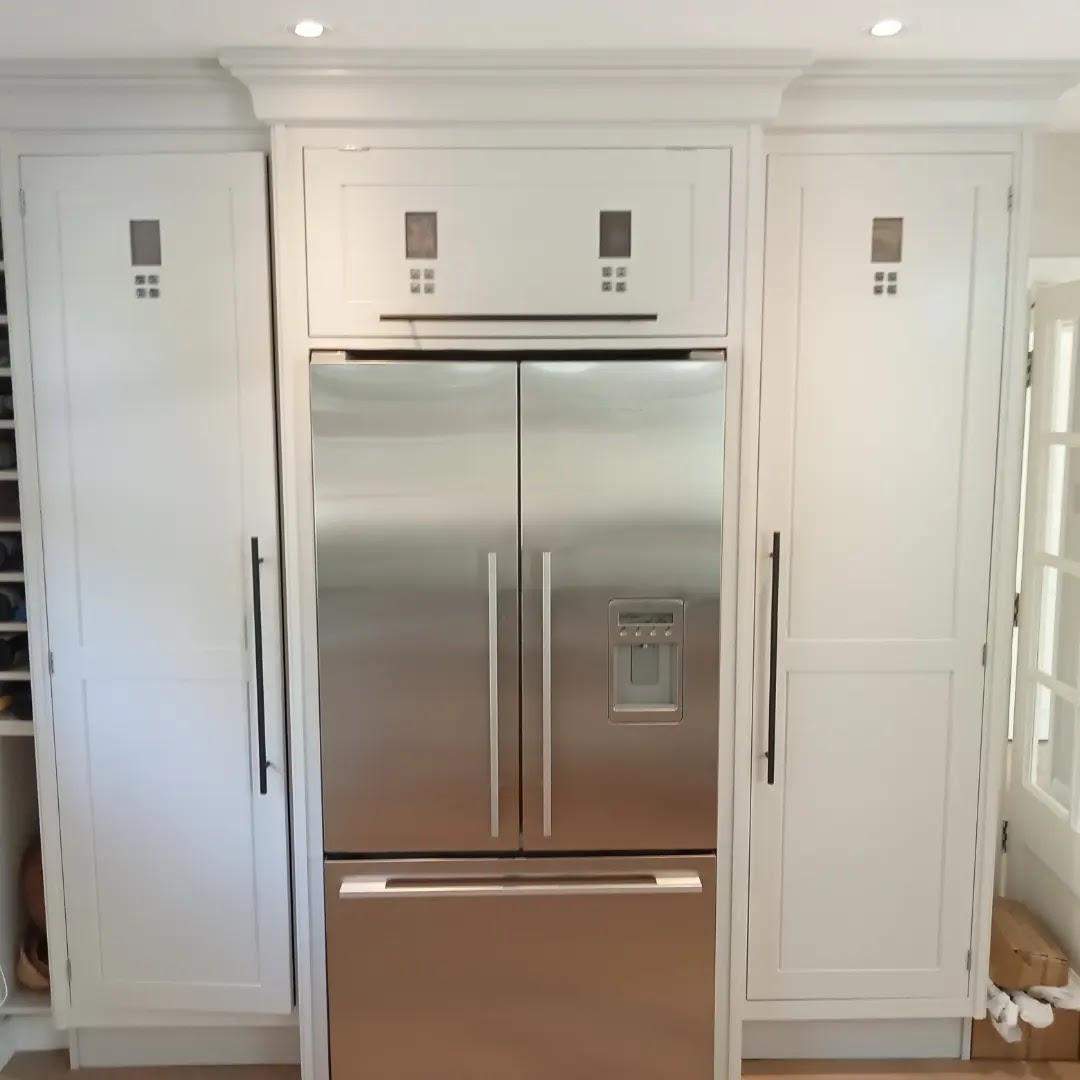 Fridge housing hand painted in kitchen