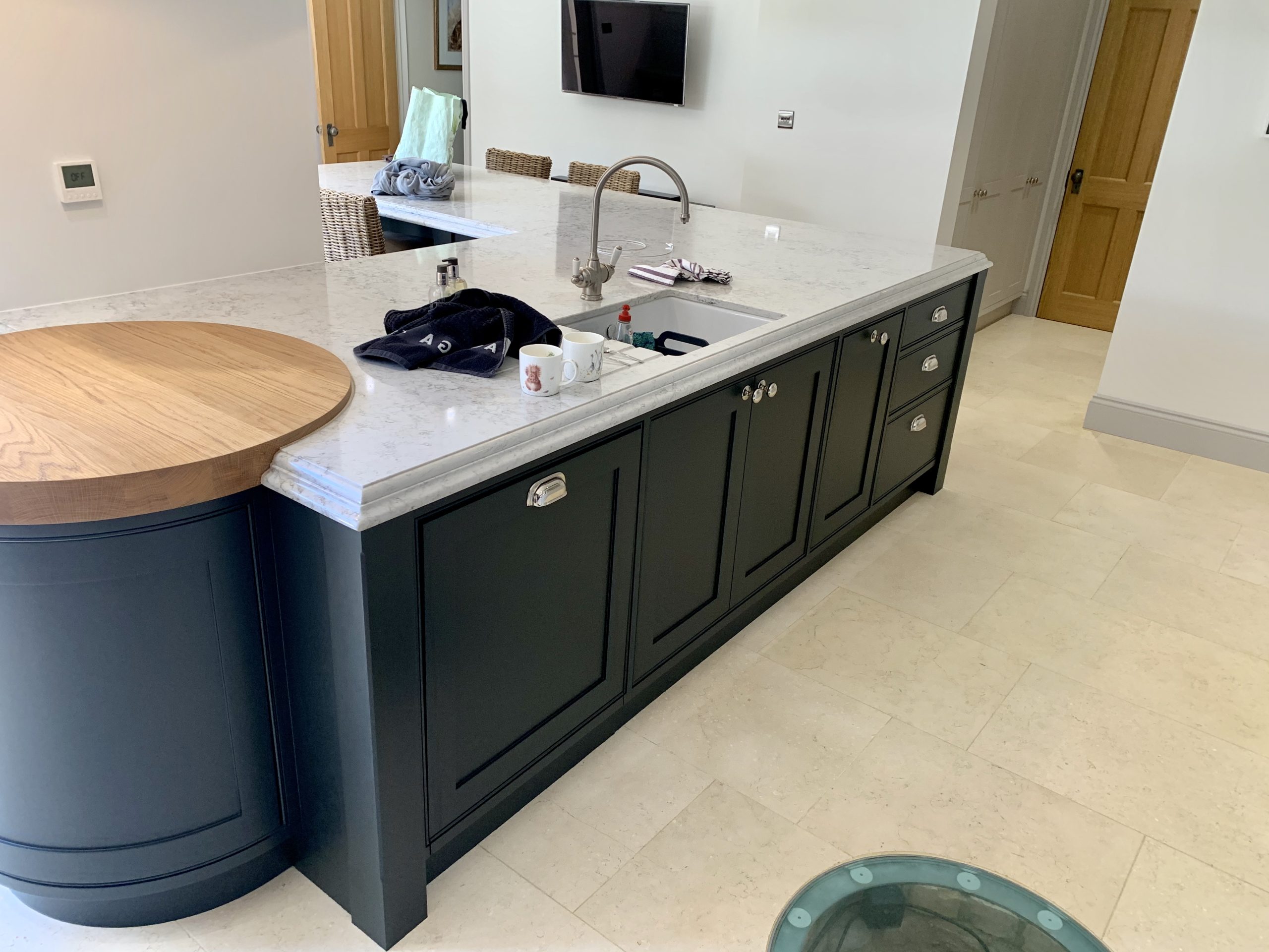 Black island with wooden worktop